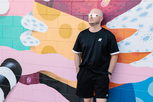 Model wearing KAM x CORE Oversize Tee size L and KAM x CORE Men's Short size M.